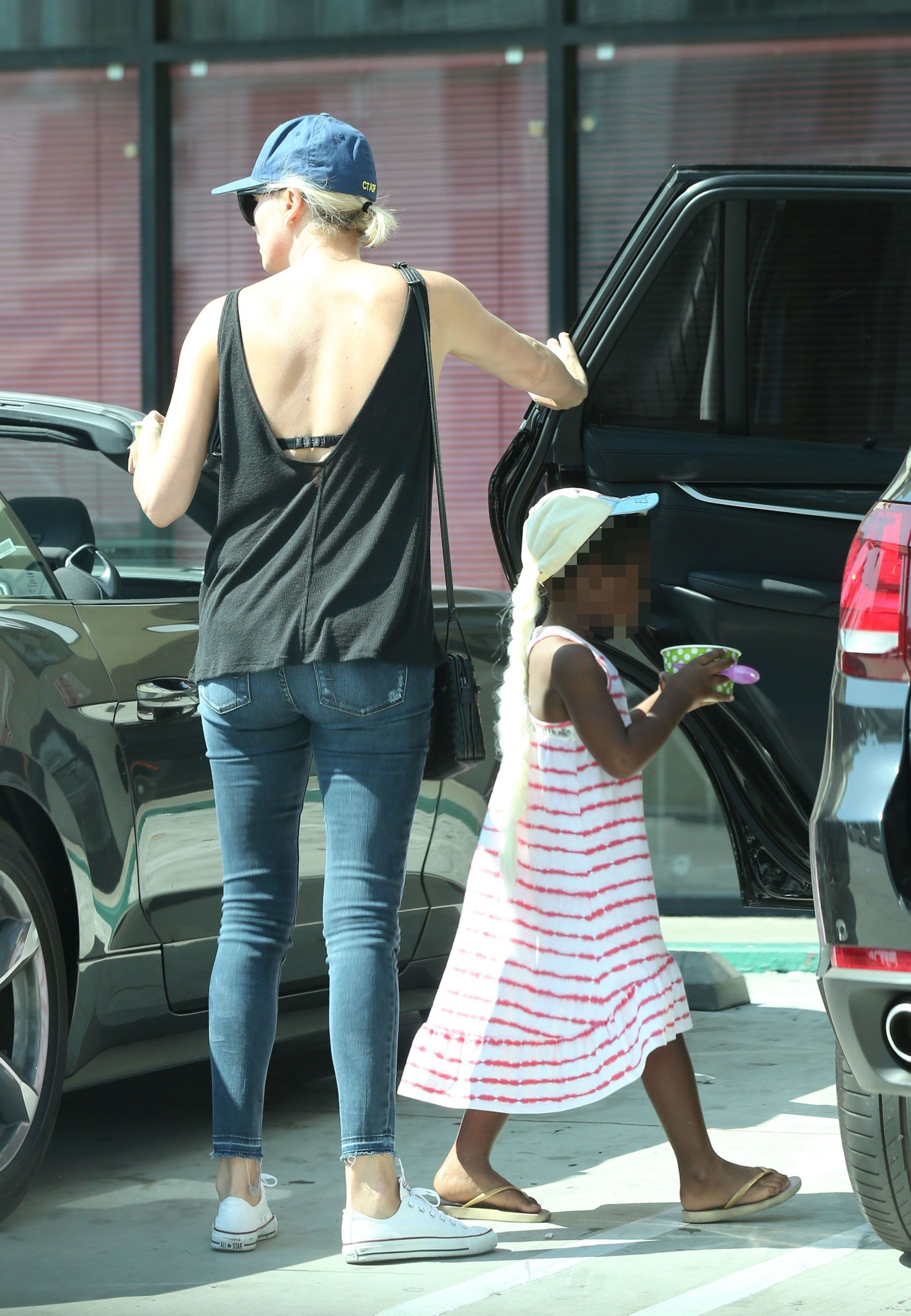 charlize theron son wearing dress